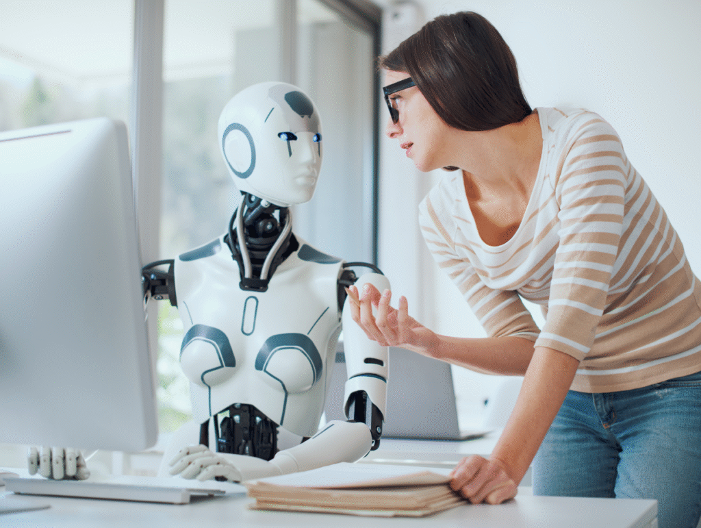 Une femme en discussion avec un robot humanoïde dans un bureau moderne, symbolisant la collaboration homme-IA dans le travail